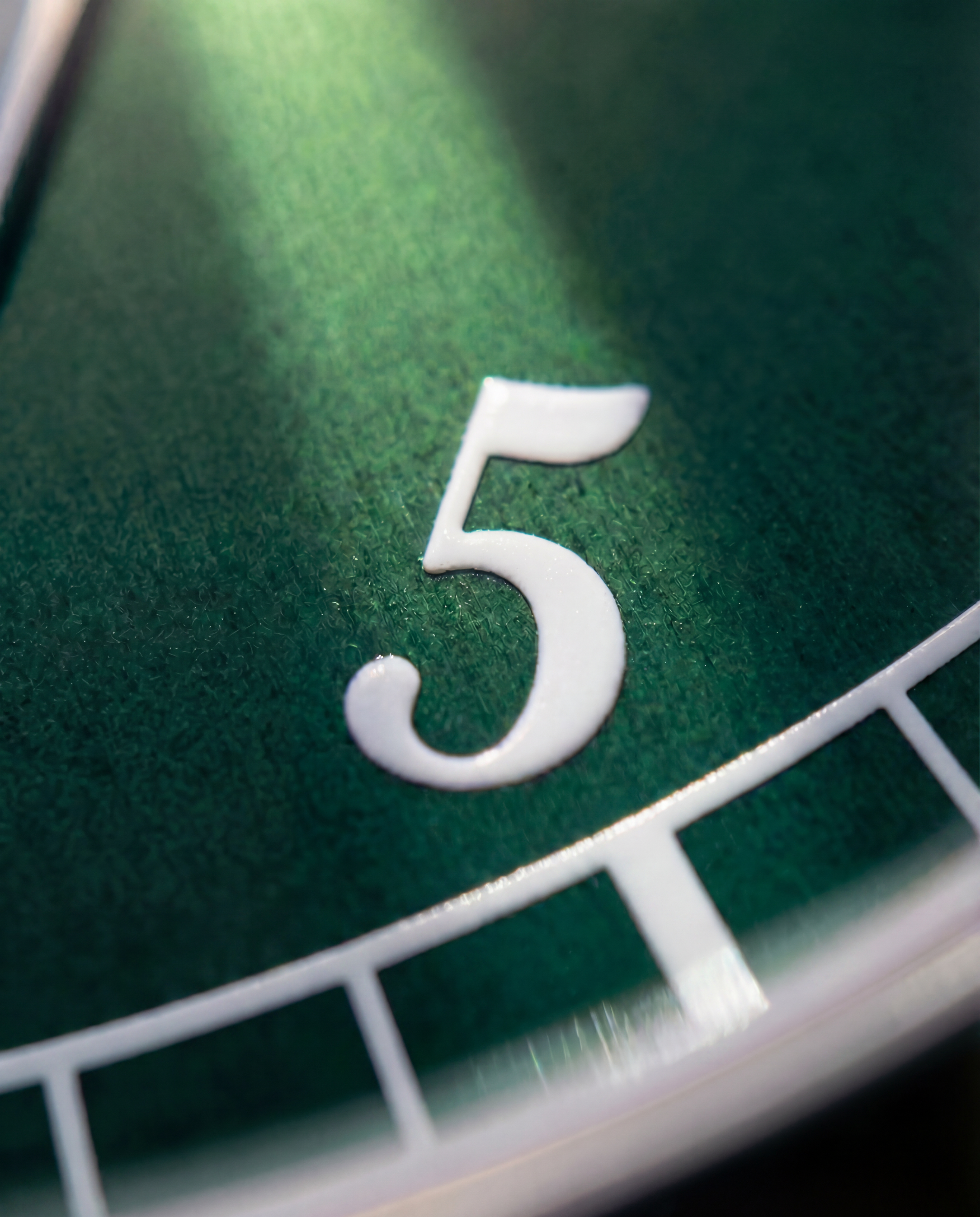 Sunburst green dial macro numeral shot