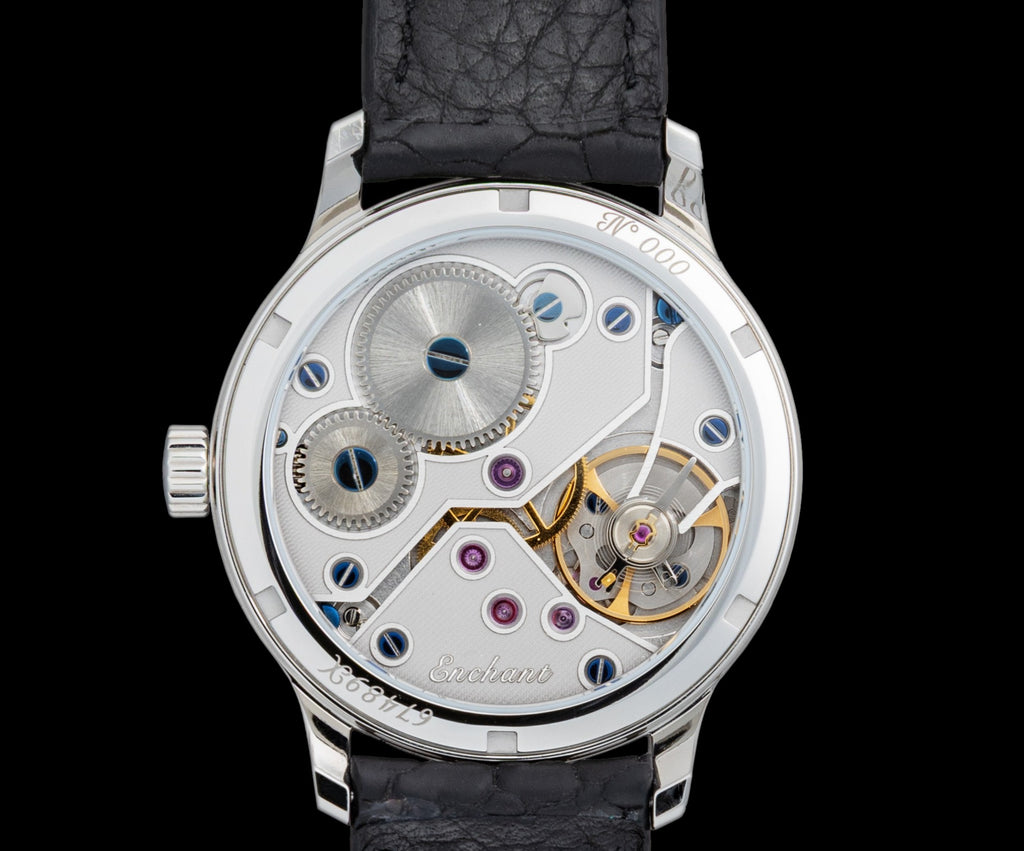White Glacier watch with blue leather strap and visible mechanical components on a black background