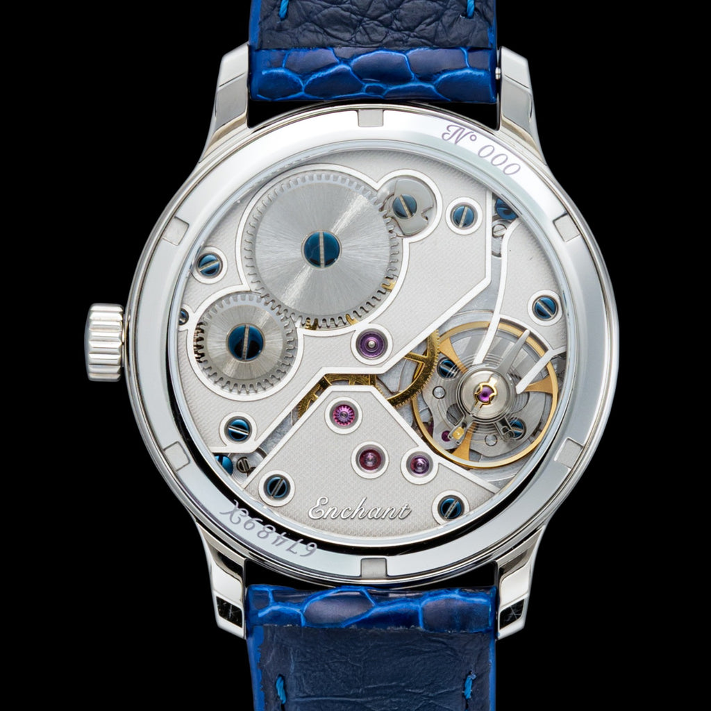 Navy Blue Voyageur watch with blue leather strap and visible mechanical components on a black background