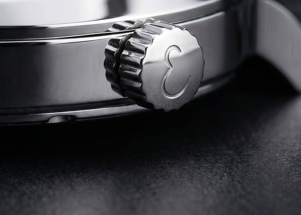 Close-up of a watch crown on a dark background