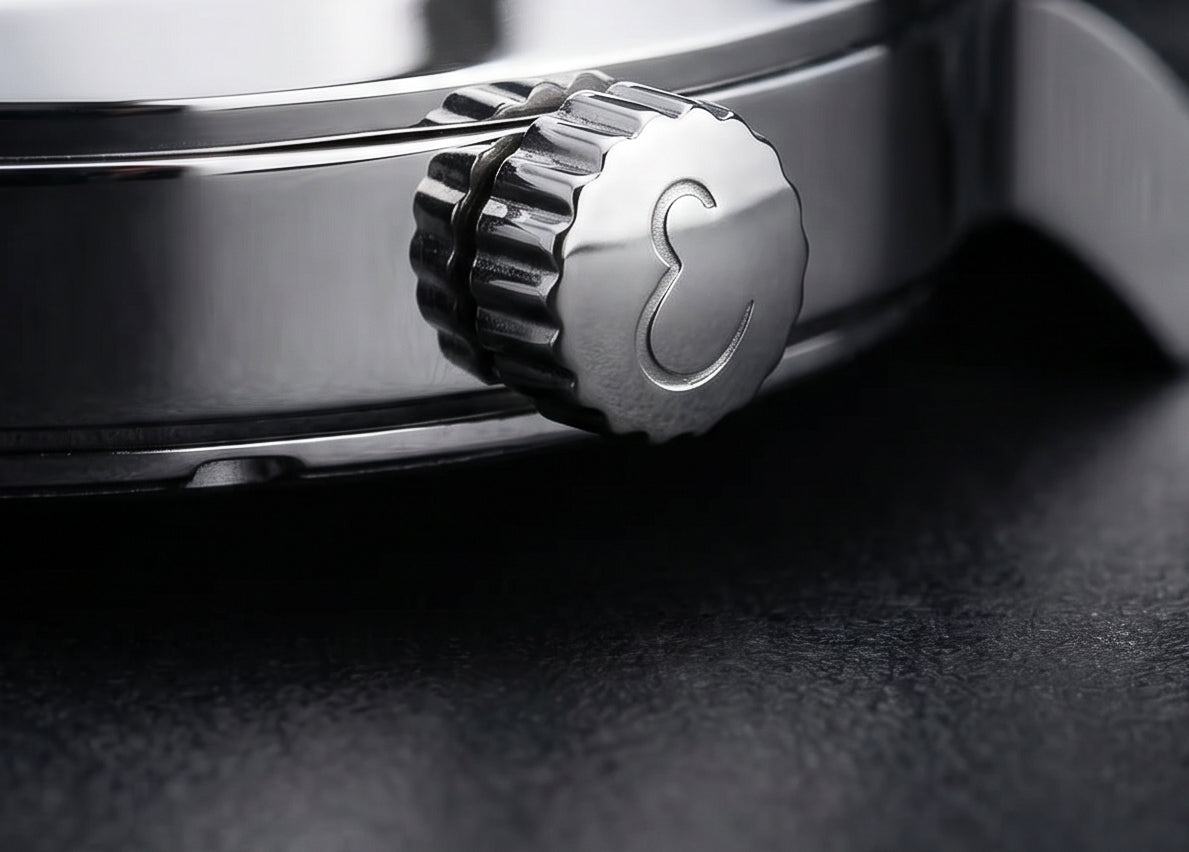 Close-up of a watch crown on a dark background